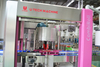 China U TECH High Speed Automatic SUS 304 Roatry 500ml 750ml Water Bottle Rolling Opp Hot Melt Labeling Machine